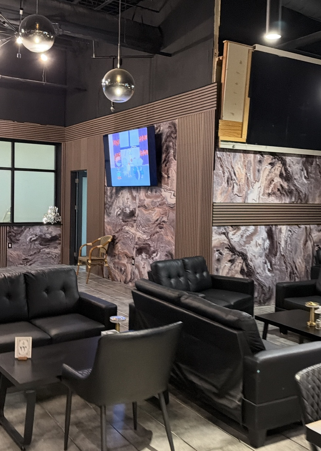 Finished commercial seating area with decorative wall panels